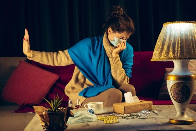 A person holding their head in their hands, sitting at a table covered with medical bills. The scene conveys a sense of stress and financial burden associated with healthcare costs.