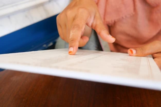 A close-up shot of a teacher's hands grading papers, highlighting the workload and the dedication required in the profession. The image should convey a sense of responsibility and commitment to student success.
