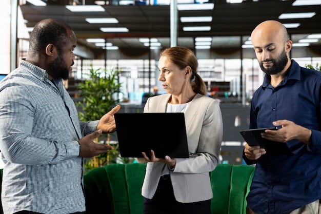 A modern office space with diverse tech professionals collaborating on a project. The image should feature individuals from various ethnic backgrounds working together in a dynamic and innovative environment.
