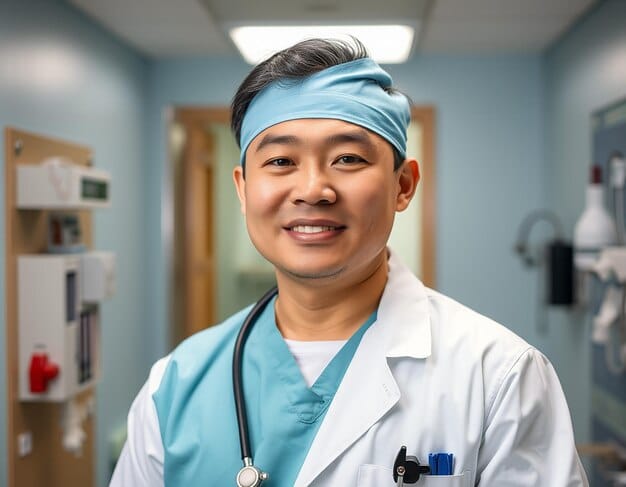 A close-up photo of a healthcare worker (nurse or doctor) of Asian descent smiling kindly at an elderly patient in a hospital room. The focus should be on the compassionate interaction and the worker's dedication.