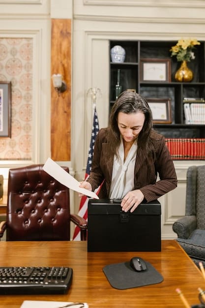 A US business owner reviewing immigration documents with an immigration attorney in a well-lit office setting.
