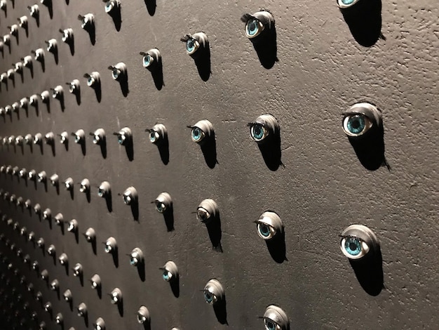 A close-up shot of various surveillance cameras mounted on a building, focusing on the integration of AI chips or sensors within the camera housings. The background is slightly blurred to emphasize the technological aspect.