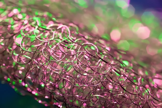 A microscopic view of silicon nanowires on an anode surface, enhanced with false color to distinguish the silicon from the carbon substrate. The nanowires are uniformly distributed and appear structurally sound, illustrating the advanced material science involved in silicon anode development.