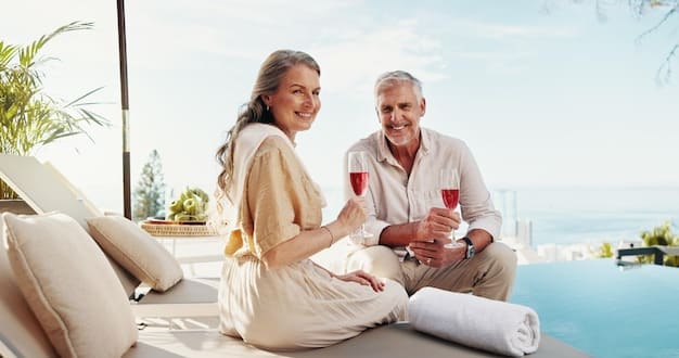 A senior couple relaxing on the balcony of their hotel room, overlooking a beautiful beach. The couple is smiling and enjoying the view, with a focus on the comfort and luxury of their accommodation.