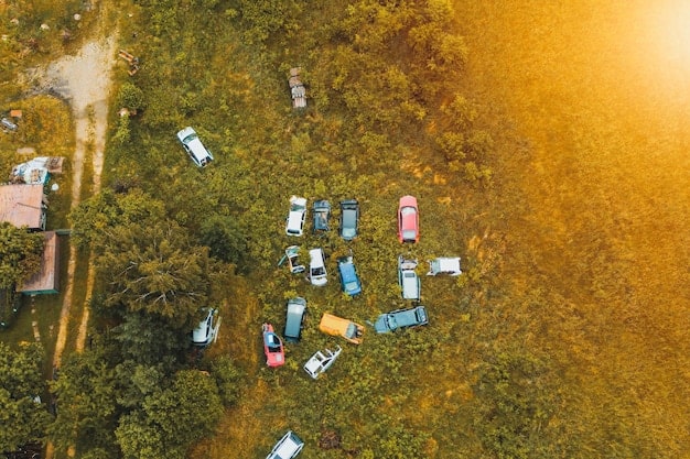 An aerial view of a well-maintained RV campground with various RVs parked at different sites, showing the layout and amenities.