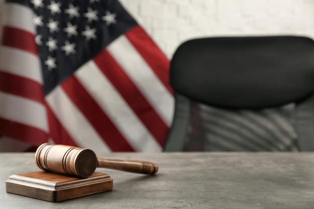 A gavel resting on a stack of legal documents with the US flag blurred in the background, representing the legal and governmental aspects of changes to immigration policy.