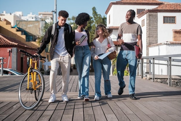 A diverse group of students walking and biking on a college campus, with a public transportation bus visible in the background.