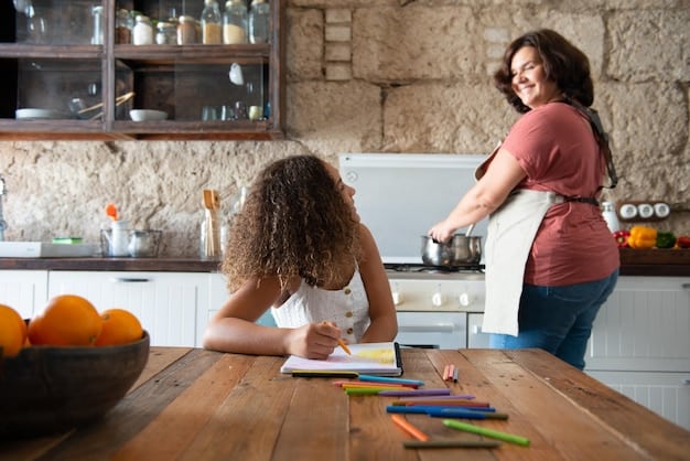 A mother is sitting at a table with her child, helping them with their homework. They are both smiling and engaged in the activity.