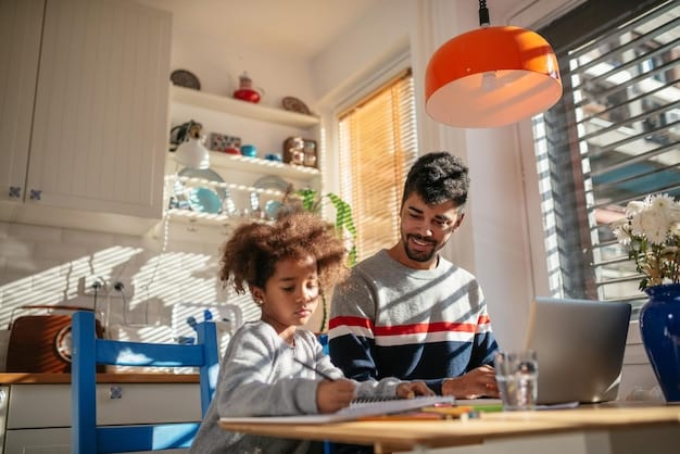 A parent and child sitting together at a table, looking at worksheets and discussing academic goals, with a laptop and books in the background.
