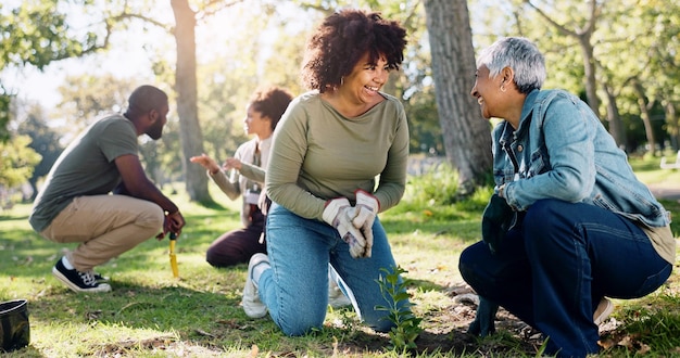 A diverse group of volunteers planting trees in a national park. The volunteers are smiling and working together, showcasing the camaraderie and positive impact of environmental volunteering.