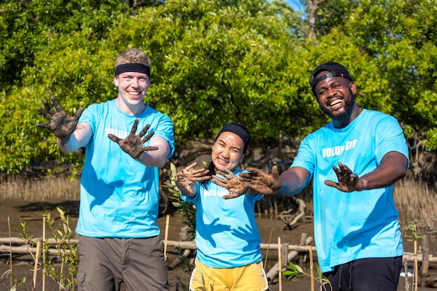 A volunteer participating in a community cleanup project. The volunteer is smiling and engaged, showcasing the positive impact of community involvement and environmental stewardship.