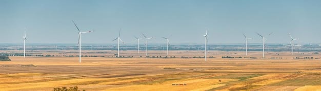 A panoramic view of a large wind farm in the Midwest, with turbines spinning against a sunset backdrop. The image should convey the scale of renewable energy infrastructure and its potential to generate clean electricity.
