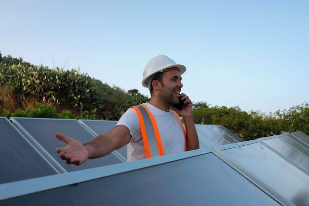 A close-up of a worker installing a solar panel on a rooftop, with suburban houses visible in the background.